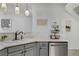 Bright kitchen space featuring a double sink, modern fixtures, and decorative shelving at 9080 Gale Blvd # 4, Thornton, CO 80260