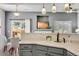 Open kitchen design with modern lighting and a view of the dining and living areas at 9080 Gale Blvd # 4, Thornton, CO 80260