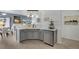 Contemporary kitchen with stainless steel appliances, sleek cabinets, and a view of the adjacent living area at 9080 Gale Blvd # 4, Thornton, CO 80260