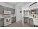Well-lit kitchen featuring modern appliances and ample countertop space at 9080 Gale Blvd # 4, Thornton, CO 80260