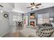 Bright living room features a cozy fireplace and an adjacent dining area, perfect for entertaining at 9080 Gale Blvd # 4, Thornton, CO 80260