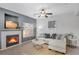 Comfortable living room with fireplace, ceiling fan, and neutral decor at 9080 Gale Blvd # 4, Thornton, CO 80260