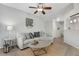Inviting living room featuring a ceiling fan and a stylish Denver-themed art piece at 9080 Gale Blvd # 4, Thornton, CO 80260