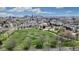 A picturesque aerial view of a community near a park, with the city skyline visible in the background at 3031 W 20Th Ave, Denver, CO 80211