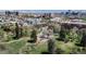 Stunning aerial view showcases the neighborhood park and the city skyline in the background at 3031 W 20Th Ave, Denver, CO 80211