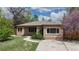 Charming brick home with a well-manicured lawn and inviting walkway, perfect for suburban living at 3031 W 20Th Ave, Denver, CO 80211
