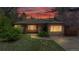 Charming brick home with well-maintained lawn, mature trees, and warm sunset glow at 3031 W 20Th Ave, Denver, CO 80211