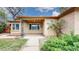 Inviting brick home with covered porch and a tidy front yard at 3031 W 20Th Ave, Denver, CO 80211