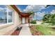 Charming brick home with a covered front porch and well-maintained landscaping at 3031 W 20Th Ave, Denver, CO 80211