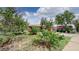 Inviting front yard with mature trees and shrubs, showcasing the home's curb appeal at 3031 W 20Th Ave, Denver, CO 80211