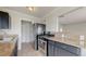 Modern kitchen featuring stainless steel appliances, and dark cabinetry at 3031 W 20Th Ave, Denver, CO 80211