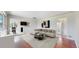 Bright living room featuring a stylish sectional sofa, modern decor, and seamless flow to the dining area at 3031 W 20Th Ave, Denver, CO 80211