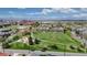 Scenic aerial view showcasing a neighborhood park, tree-lined streets, and mountain views in the distance at 3031 W 20Th Ave, Denver, CO 80211