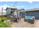Spacious backyard patio with seating and dining area, perfect for outdoor entertaining at 4879 S Johnson St, Littleton, CO 80123