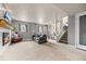 Spacious finished basement with a fireplace, large sofa, and stairs to the main level at 4879 S Johnson St, Littleton, CO 80123