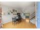 Inviting dining room with hardwood floors, stylish decor, and an open view into the kitchen area at 4879 S Johnson St, Littleton, CO 80123