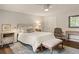 Comfortable bedroom with natural light, ceiling fan, and stylish furnishings at 6128 S Coventry E Ln, Littleton, CO 80123