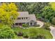Charming home with mature trees, lush green lawn and colorful landscaping at 6128 S Coventry E Ln, Littleton, CO 80123