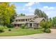 Beautiful two-story home with manicured lawn, mature trees and a tranquil suburban setting at 6128 S Coventry E Ln, Littleton, CO 80123