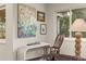 Comfortable living area with a console table, window views, and unique decor at 6128 S Coventry E Ln, Littleton, CO 80123
