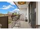 Spacious balcony with bar seating, string lights, and a stunning view of the neighborhood at 799 Dahlia St # 503, Denver, CO 80220