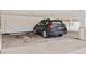 Covered parking spot featuring a gray Subaru Outback at 799 Dahlia St # 503, Denver, CO 80220