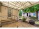 Backyard patio and entrance to detached garage featuring a charcoal grill at 2845 Eaton St, Wheat Ridge, CO 80214