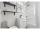 Well-lit bathroom featuring subway tile, sleek fixtures, and modern finishes at 2845 Eaton St, Wheat Ridge, CO 80214