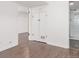 Basement hallway leads to the bathroom, storage closet, and living area at 2845 Eaton St, Wheat Ridge, CO 80214
