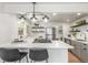 Modern kitchen with sleek stainless steel appliances, a gas range, and a stylish breakfast bar with seating at 2845 Eaton St, Wheat Ridge, CO 80214