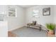 Bright room with bench seat, patterned rug and modern interior design at 2845 Eaton St, Wheat Ridge, CO 80214