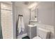 Updated bathroom with a shower, subway tile, and a gray vanity at 12425 Bellaire Dr, Thornton, CO 80241
