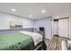 Relaxing bedroom with a bed, TV, and neutral decor at 12425 Bellaire Dr, Thornton, CO 80241