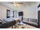 Bedroom with ceiling fan, geometric area rug, and seating area at 12425 Bellaire Dr, Thornton, CO 80241