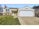 Charming two-story home featuring a two-car garage, landscaped front yard, and inviting entrance at 12425 Bellaire Dr, Thornton, CO 80241