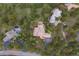 Aerial view of luxury homes with well manicured lawns surrounded by lush forests at 1952 Columbine Ct, Golden, CO 80401
