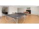 Recreational basement area with ping pong table, fireplace, and ample space for entertaining at 1952 Columbine Ct, Golden, CO 80401