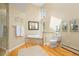 Bright bathroom featuring a separate shower, soaking tub, and modern fixtures at 1952 Columbine Ct, Golden, CO 80401