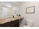 Bathroom featuring granite countertops, dark wood cabinetry, and a neutral color scheme at 1952 Columbine Ct, Golden, CO 80401
