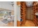 Spacious walk-in closet with custom shelving and mirrored door at 1952 Columbine Ct, Golden, CO 80401
