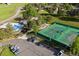 Community tennis court, pool, playground, parking, and sidewalks surrounded by lush, mature trees at 1952 Columbine Ct, Golden, CO 80401