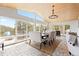 Elegant dining room features large windows offering picturesque views and access to the outdoor deck at 1952 Columbine Ct, Golden, CO 80401