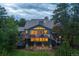 Stunning home featuring a spacious outdoor patio with a hot tub and a stone seating area at 1952 Columbine Ct, Golden, CO 80401