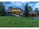 Charming two-story home with an attached two car garage and a well-manicured green lawn at 1952 Columbine Ct, Golden, CO 80401