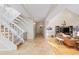 Inviting foyer with high ceilings, travertine floors, and a view into the living space at 1952 Columbine Ct, Golden, CO 80401