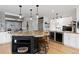 Spacious kitchen featuring an island with a granite countertop and stainless steel appliances at 1952 Columbine Ct, Golden, CO 80401