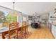 Bright open kitchen and dining area with a large island, modern appliances, and scenic views at 1952 Columbine Ct, Golden, CO 80401