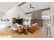 Spacious living room boasts a stone fireplace, hardwood floors, and easy access to the kitchen at 1952 Columbine Ct, Golden, CO 80401