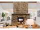 Inviting living room featuring a stone fireplace and an open-concept design for seamless entertaining at 1952 Columbine Ct, Golden, CO 80401