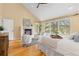 Inviting main bedroom boasts a fireplace, large windows, and comfortable seating area at 1952 Columbine Ct, Golden, CO 80401